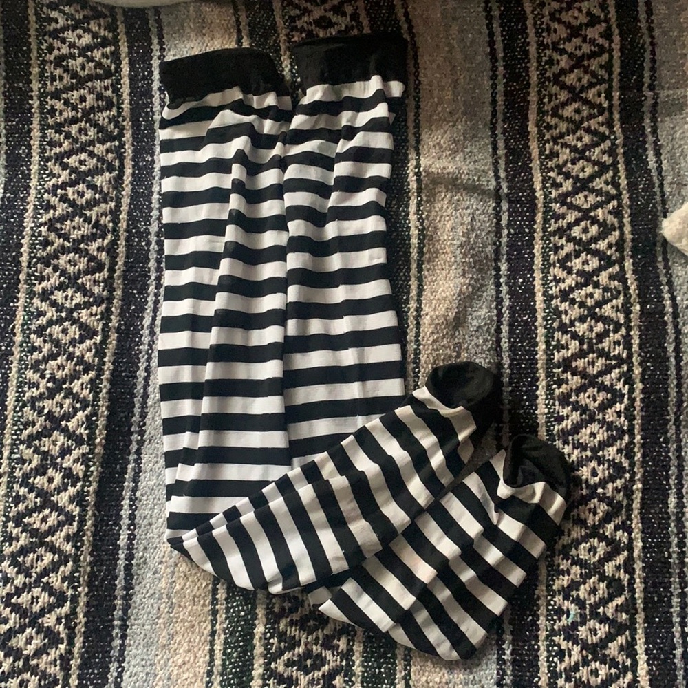 thigh high stripped socks, don’t ride down and fits most